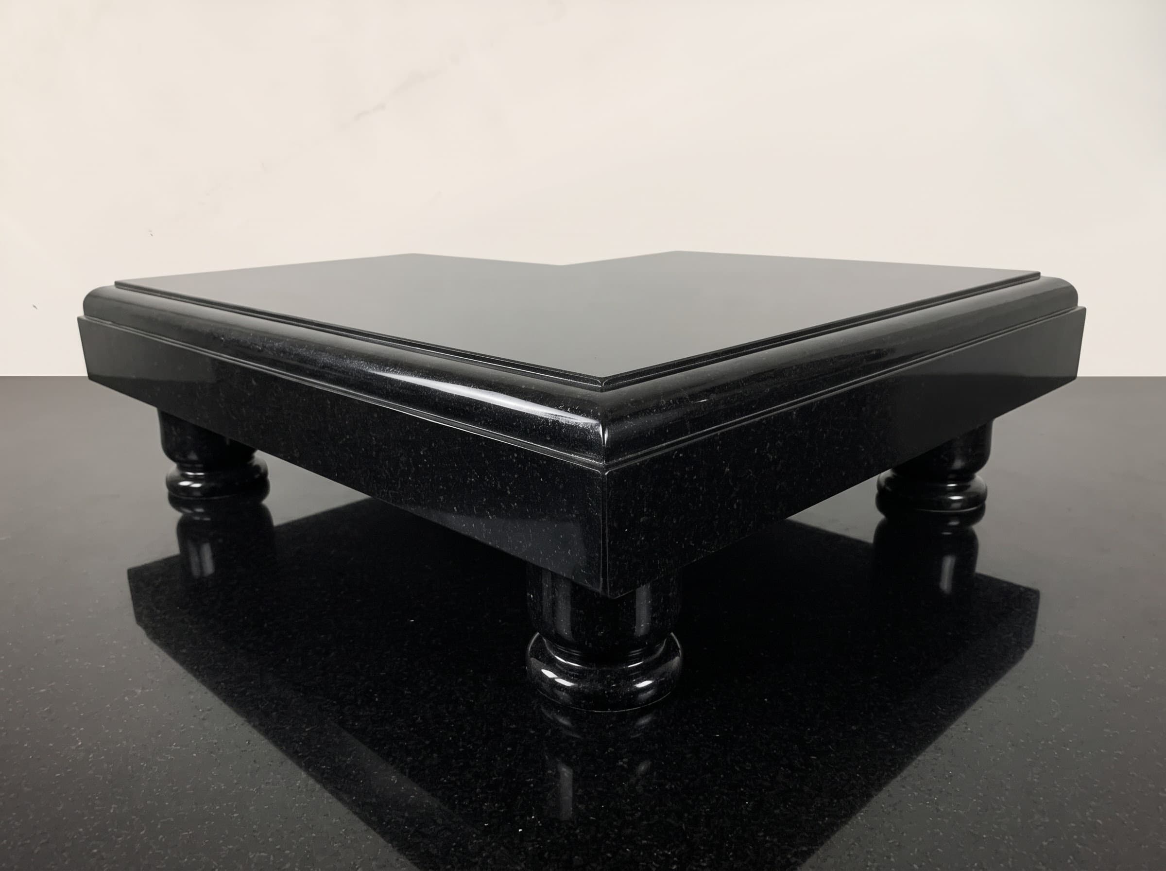 Low black granite chowki table with turned legs